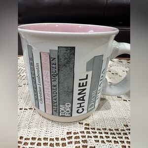 Coffee mug with Famous Designer’s logo. Excellent condition holds 14oz.